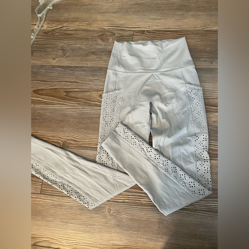 Aerie never worn grey leggings with flower cut out detailing on the legs